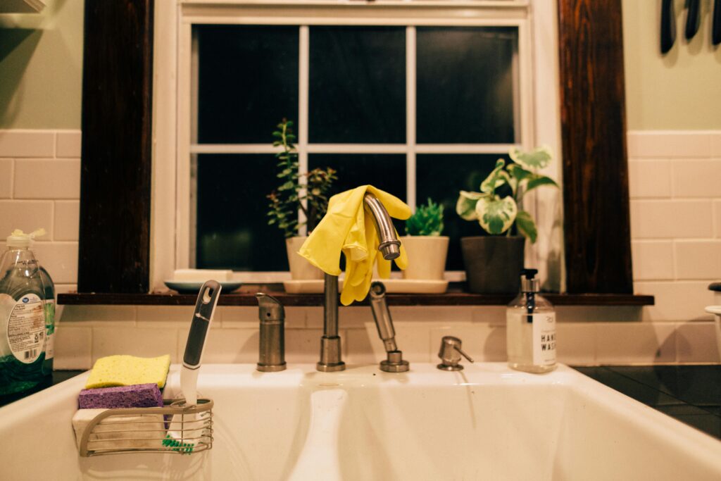 Warm kitchen sink at night during an evening home reset
